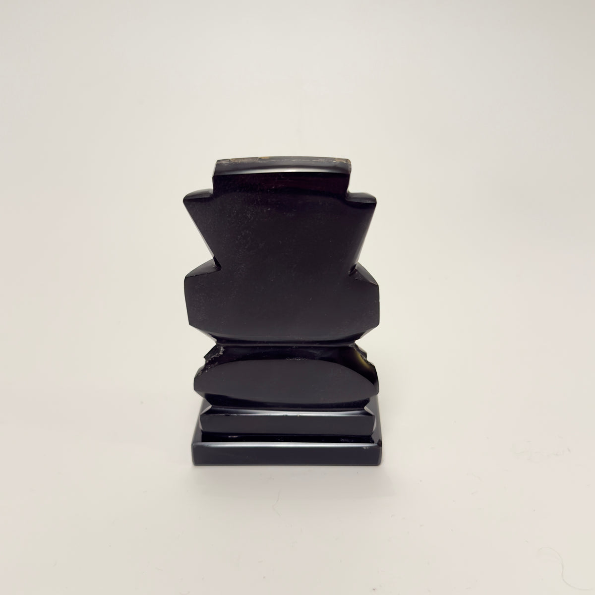 Hand-carved Mexican figurine in black obsidian with mother-of-pearl