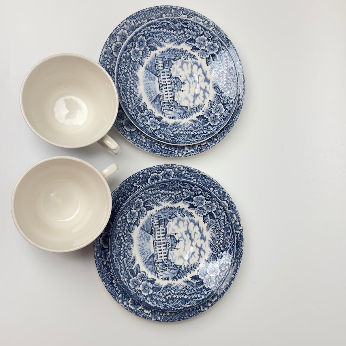 Two trio sets of Imerco 50th anniversary tableware, Rosenborg Castle and Fredensborg Castle 1978