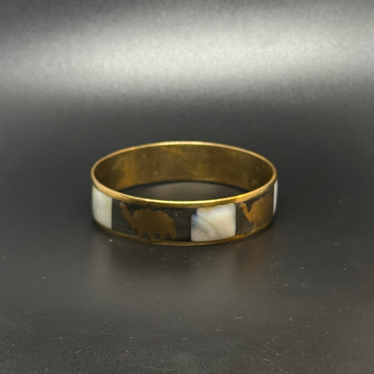 Vintage brass bracelet with mother-of-pearl and elephants