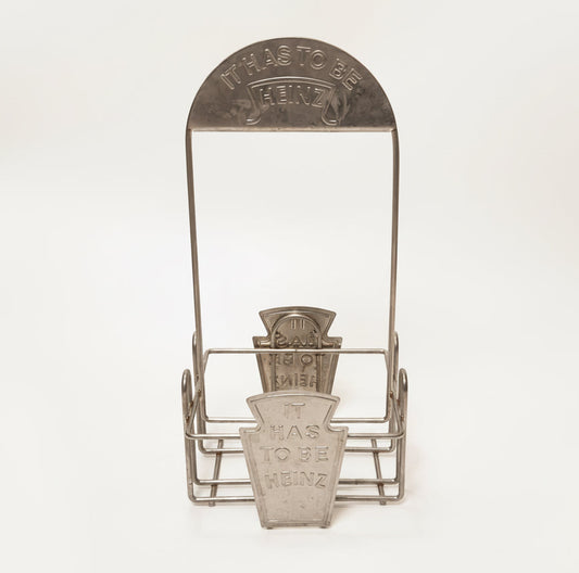 Vintage Heinz flaskeholder / condiment caddy i metal – “It Has To Be Heinz”