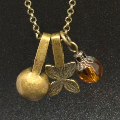 Necklace with pendant in antique gold-colored metal