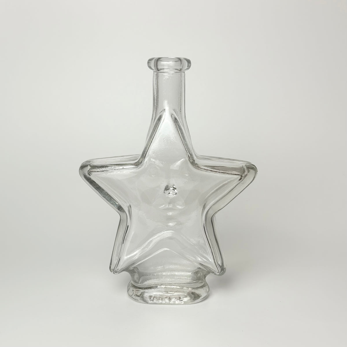 Vintage star carafe in clear glass with face – 18 cm