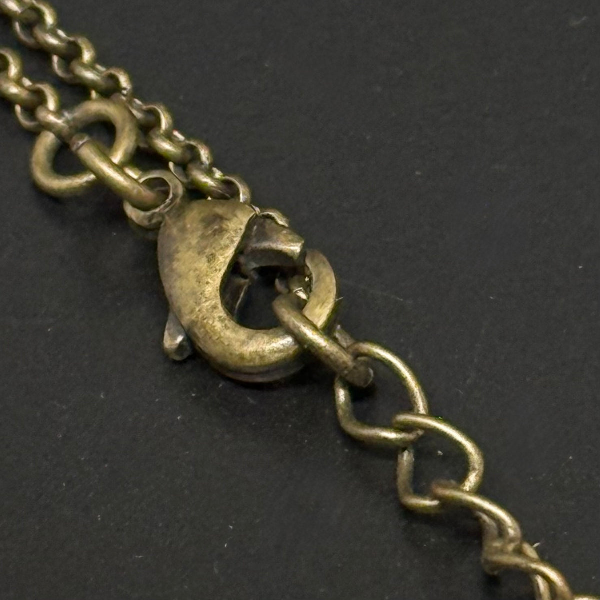 Necklace with pendant in antique gold-colored metal